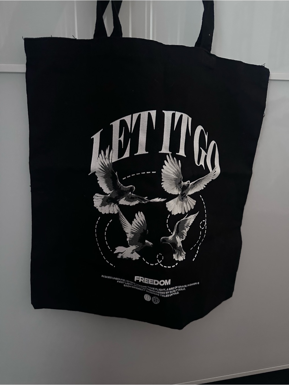 LET IT GO Black Graphic Tote with White Dove Print